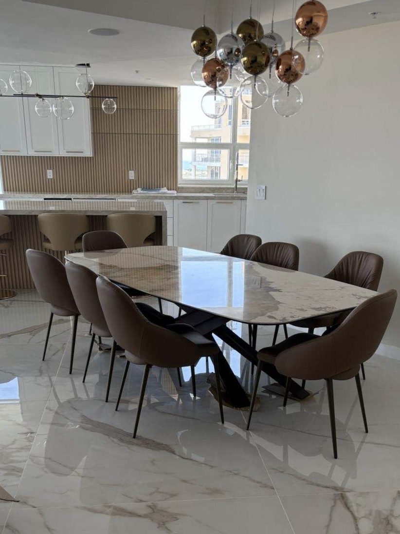 Move-in ready dining and kitchen space with clean marble floors
